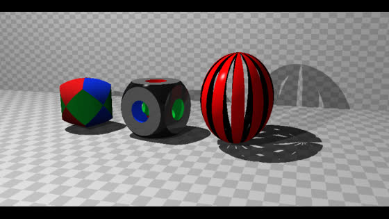 Tricylinder, carved cube, and a red hollow sphere with ellipsoid-cut openings